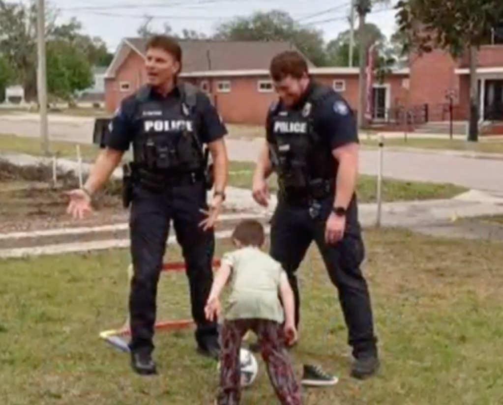 Loki King plays soccer with police officers on 6th birthday. 